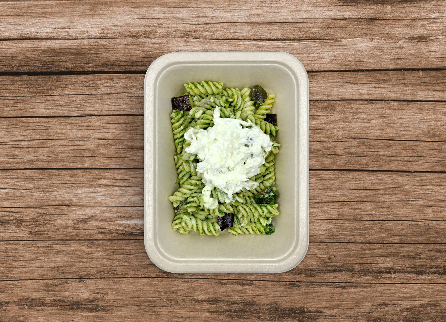 Fusilli con pesto di rucola, melanzane e stracciatella