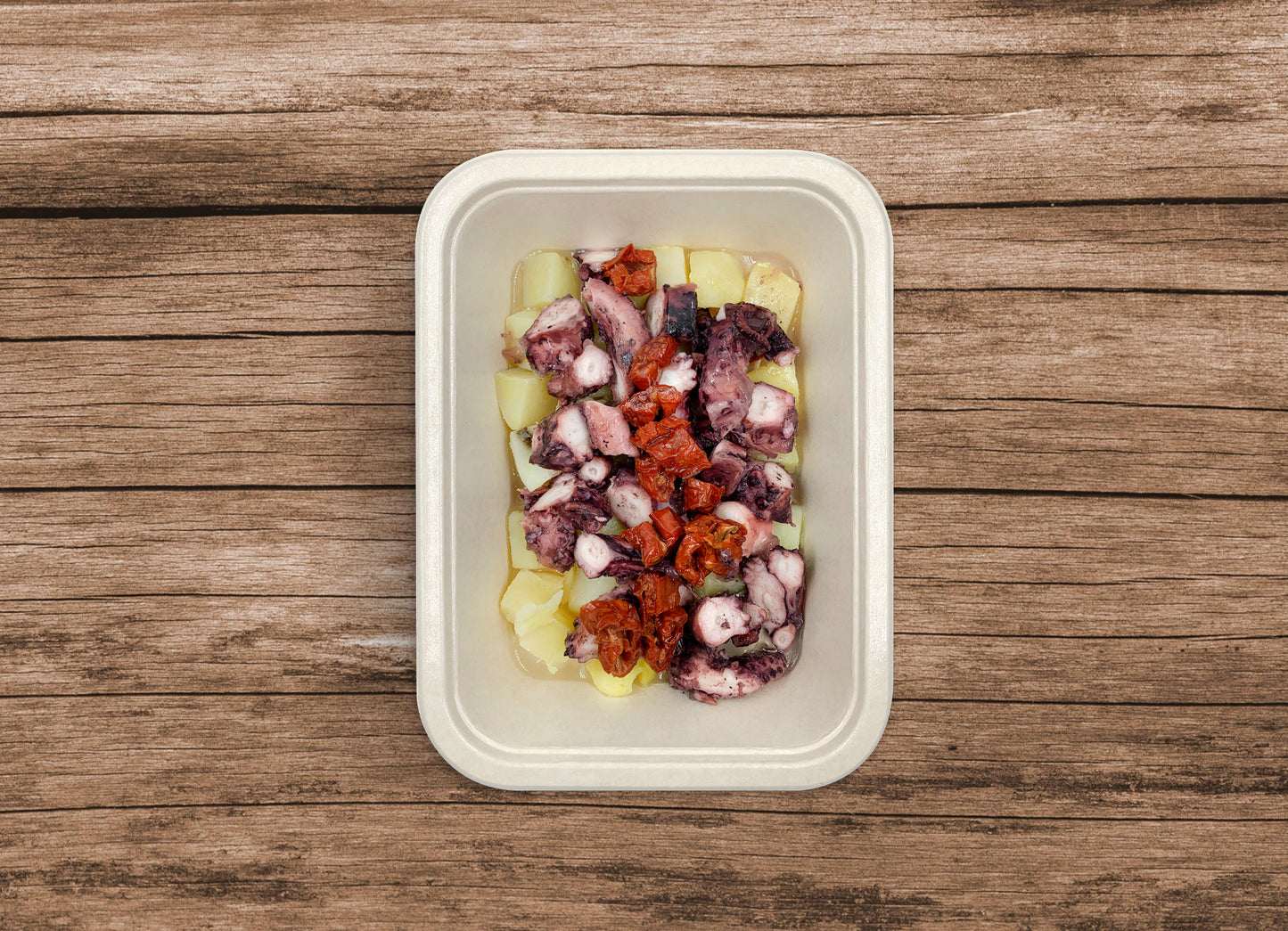 Polpo con patate e pomodori secchi